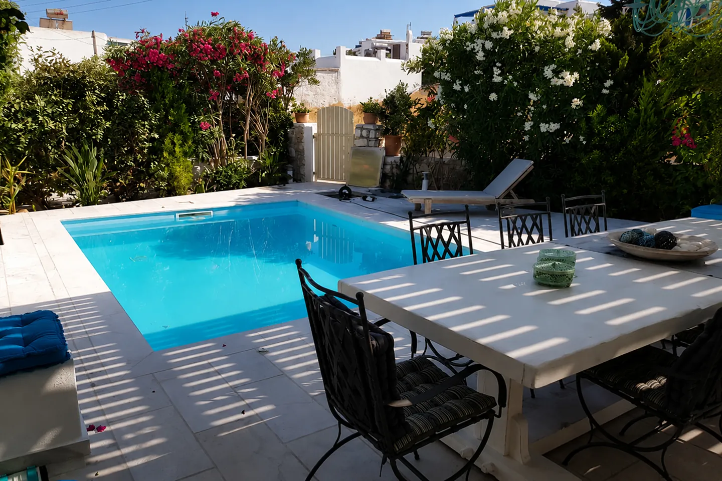 Poolside dining terrace at Villa Nausithoe