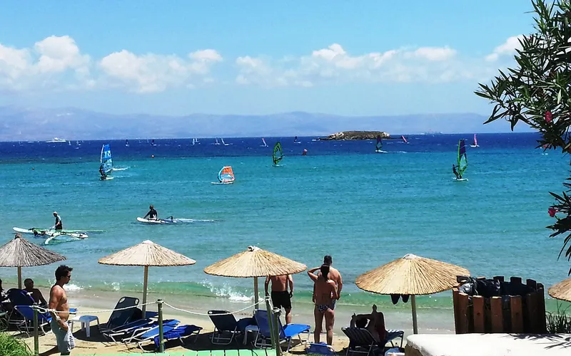 Beach umbrellas by the sea in Paros