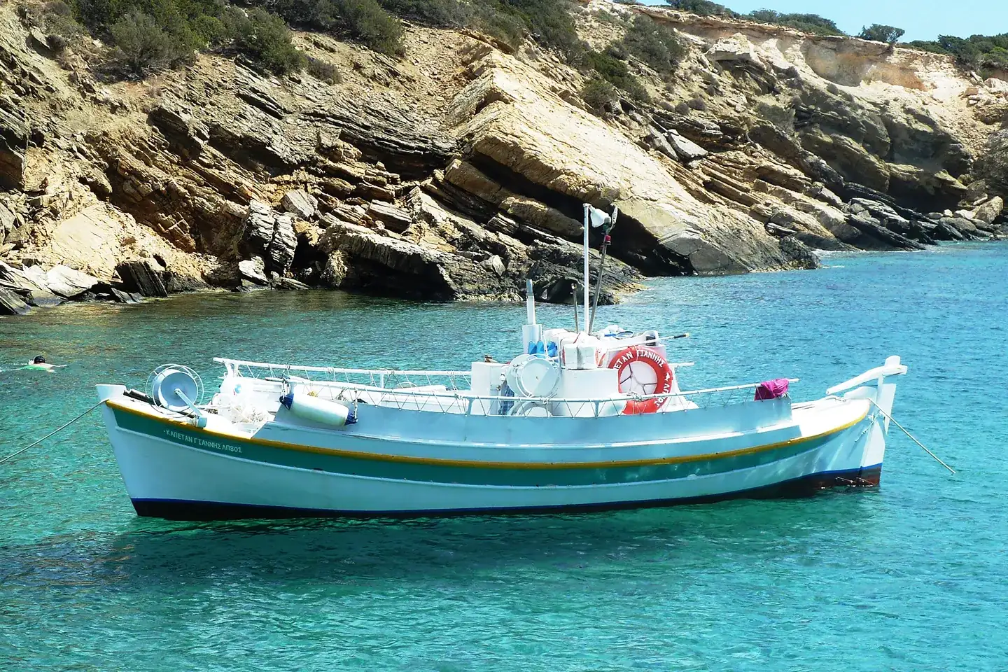 Fishing boat in a quiet cove in Paros